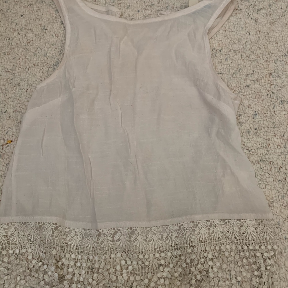 Tank top with tassels hanging off the bottom